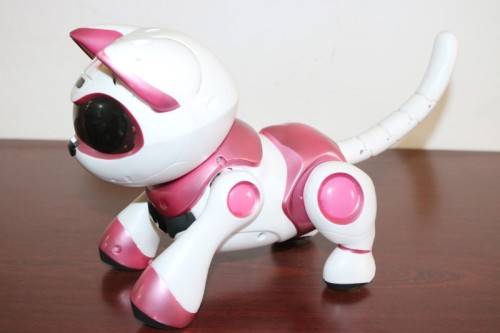 A pink "Tekno Kitty" intelligent robotic toy that interacts with its environment, great gift 4 kids!