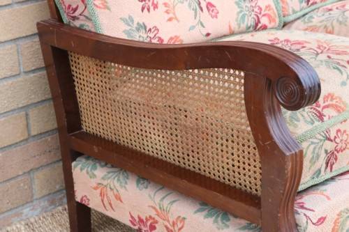 A wonderful antique hand carved ball and claw three-seater wicker-back sofa w/ upholstered cushions