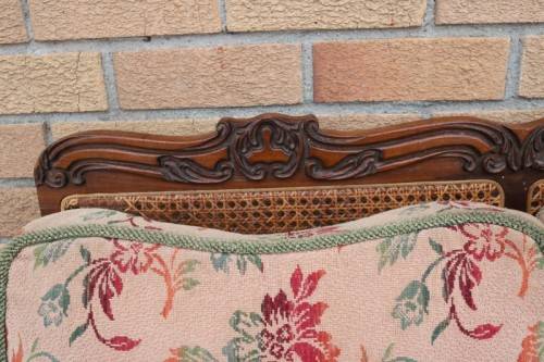 A wonderful antique hand carved ball and claw three-seater wicker-back sofa w/ upholstered cushions