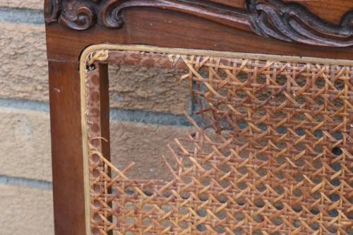 A wonderful antique hand carved ball and claw three-seater wicker-back sofa w/ upholstered cushions