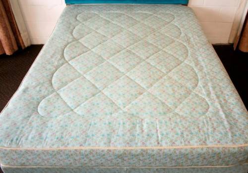 A stunning upholstered double-bed buttoned headboard with a Warner mattress & base.RS17Bed