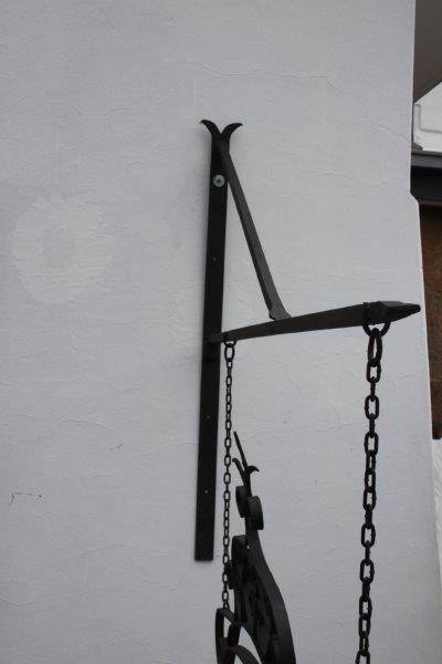 An awesome large wrought iron "Barney's Pub, Gold Reef City" signage wall frame with the bracket