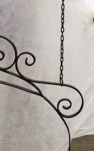 An awesome large wrought iron "Barney's Pub, Gold Reef City" signage wall frame with the bracket