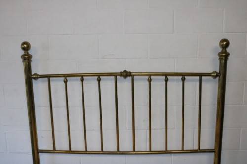 An amazing vintage Queen-size brass bed with a stunning brass headboard and footboard.RS17Bed
