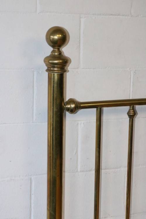 An amazing vintage Queen-size brass bed with a stunning brass headboard and footboard.RS17Bed