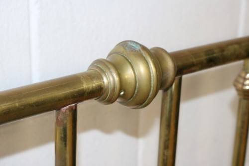 An amazing vintage Queen-size brass bed with a stunning brass headboard and footboard.RS17Bed