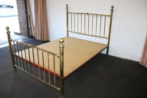 An amazing vintage Queen-size brass bed with a stunning brass headboard and footboard.RS17Bed