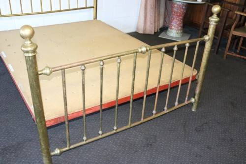 An amazing vintage Queen-size brass bed with a stunning brass headboard and footboard.RS17Bed