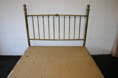 An amazing vintage Queen-size brass bed with a stunning brass headboard and footboard.RS17Bed