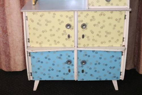 A fantastic Art Deco Hoosier kitchen cabinet w/ loads of cupboard space & a built in clock