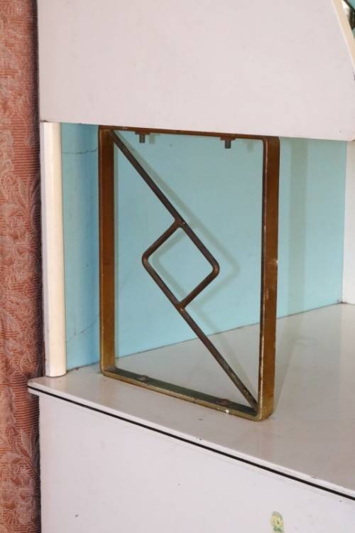 A fantastic Art Deco Hoosier kitchen cabinet w/ loads of cupboard space & a built in clock