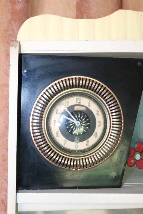 A fantastic Art Deco Hoosier kitchen cabinet w/ loads of cupboard space & a built in clock