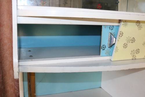 A fantastic Art Deco Hoosier kitchen cabinet w/ loads of cupboard space & a built in clock