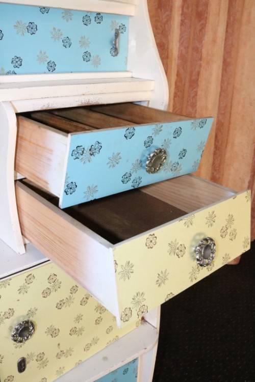 A fantastic Art Deco Hoosier kitchen cabinet w/ loads of cupboard space & a built in clock