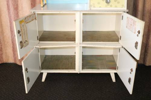 A fantastic Art Deco Hoosier kitchen cabinet w/ loads of cupboard space & a built in clock