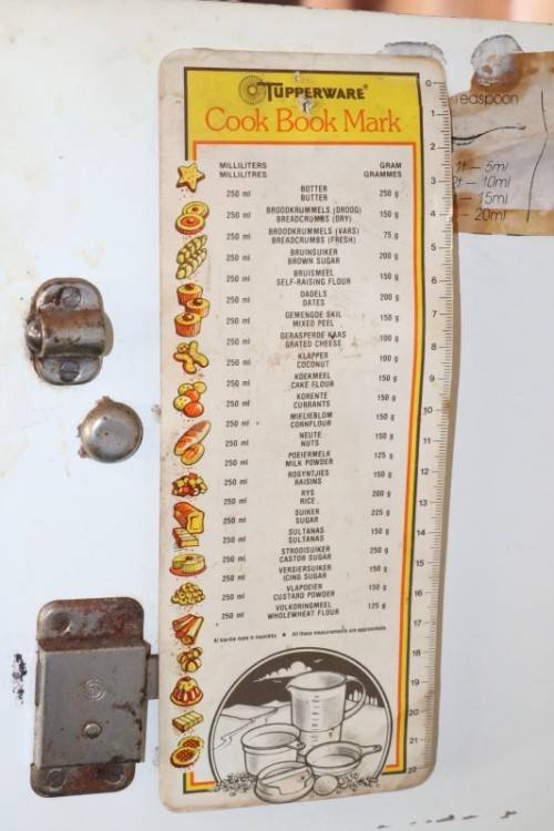 A fantastic Art Deco Hoosier kitchen cabinet w/ loads of cupboard space & a built in clock