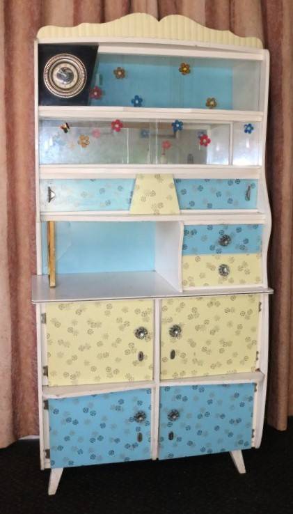 A fantastic Art Deco Hoosier kitchen cabinet w/ loads of cupboard space & a built in clock