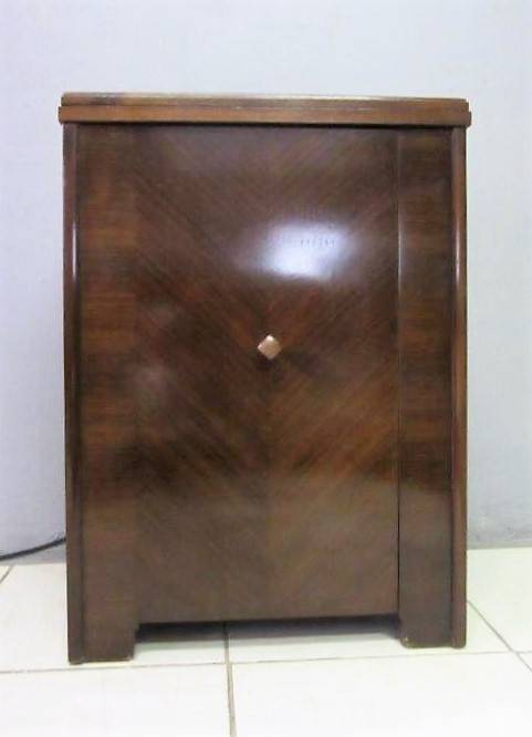 An incredible vintage (1930) singer "treadle" sewing machine in its cabinet in wonderful condition