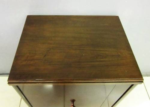 An incredible vintage (1930) singer "treadle" sewing machine in its cabinet in wonderful condition