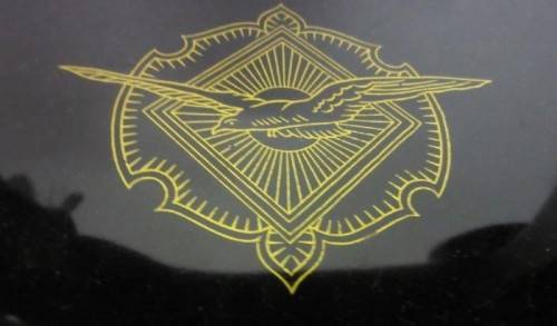 An incredible vintage (1930) singer "treadle" sewing machine in its cabinet in wonderful condition