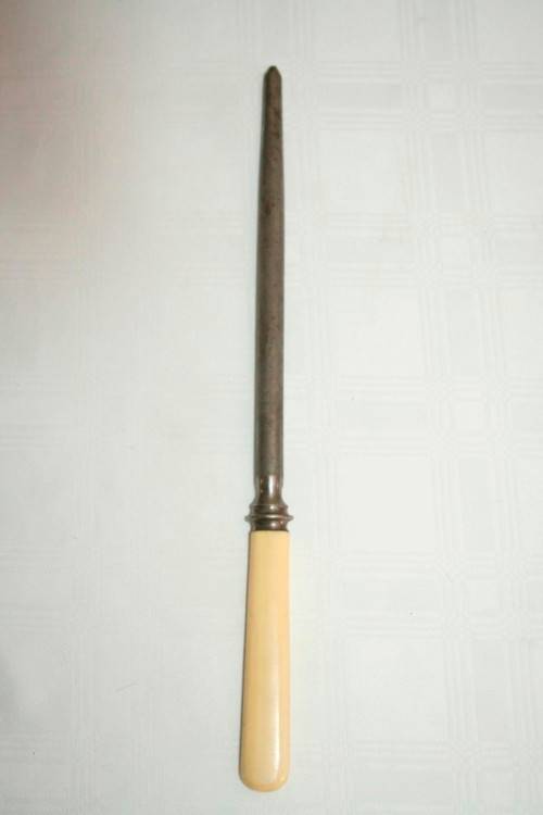 A stunning vintage boxed bone handle style carving knife and fork set with a sharpening steel