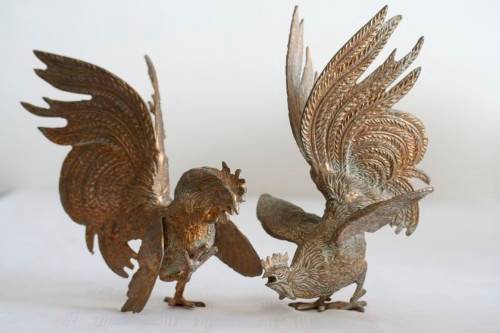 A stunning pair of rare dramatic vintage Italian made brass fighting roosters in great condition