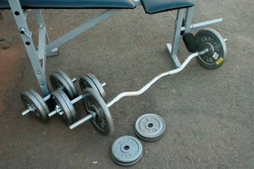 A fantastic original Trojan "Performa 300" bench & assorted weights in awesome condition