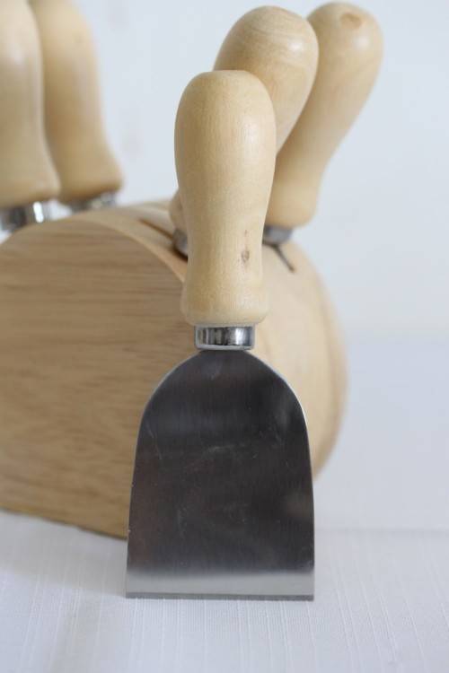A wonderful stainless steel cheese knives and fork set in a wooden holder - an amazing gift!