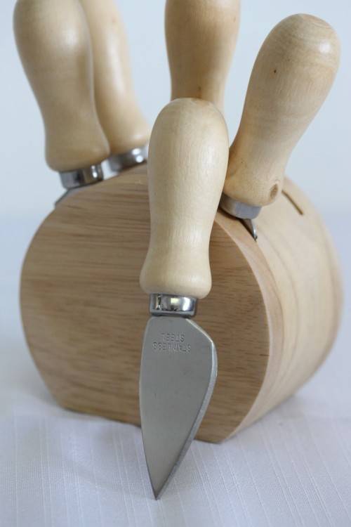 A wonderful stainless steel cheese knives and fork set in a wooden holder - an amazing gift!