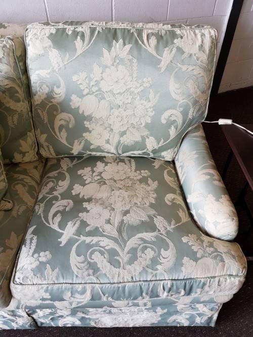 A wonderful "Moorgas & Sons" Brocade fabric couch with cushions & a floral pattern on it