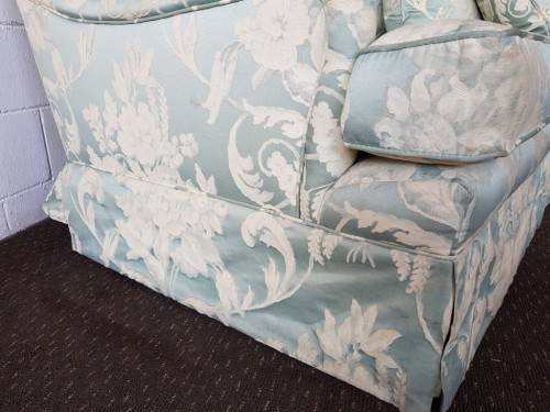 A wonderful "Moorgas & Sons" Brocade fabric couch with cushions & a floral pattern on it