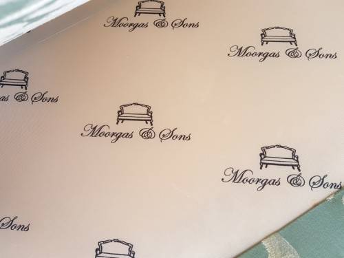 A wonderful "Moorgas & Sons" Brocade fabric couch with cushions & a floral pattern on it