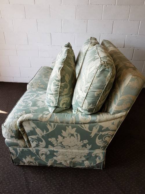 A wonderful "Moorgas & Sons" Brocade fabric couch with cushions & a floral pattern on it