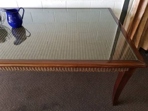 An awesome x-large 10-12 seater Mahogany dining table w/ wicker inlay under the glass top!