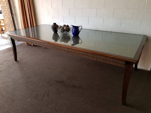 An awesome x-large 10-12 seater Mahogany dining table w/ wicker inlay under the glass top!