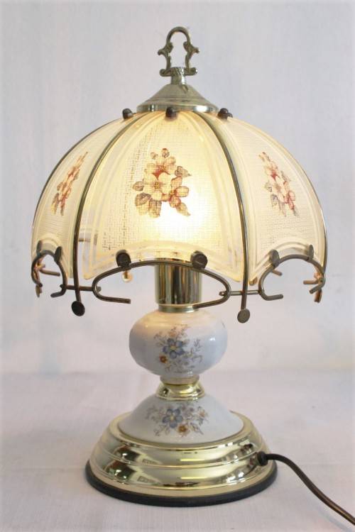 A lovely parlour table lamp with a glass panelled shade and brass-finished base - stunning on a desk