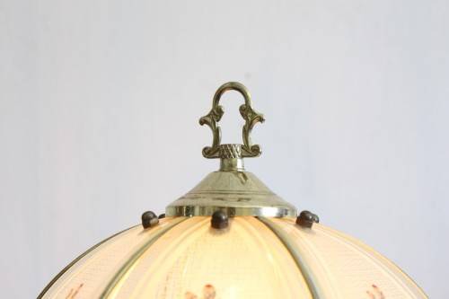 A lovely parlour table lamp with a glass panelled shade and brass-finished base - stunning on a desk