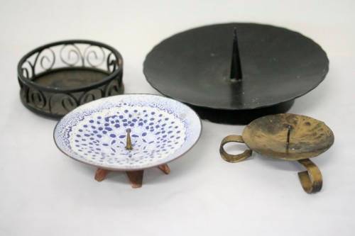 **RS17** Four lovely assorted metal candle holders, perfect in informal living areas.
