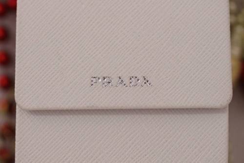 An awesome pair of black Italian made Prada (model SPR22M) ladies sunglasses w/ grey gradient lenses
