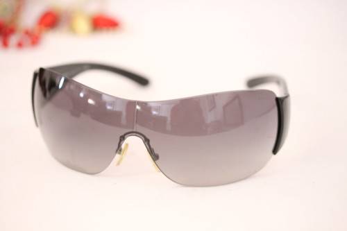 An awesome pair of black Italian made Prada (model SPR22M) ladies sunglasses w/ grey gradient lenses