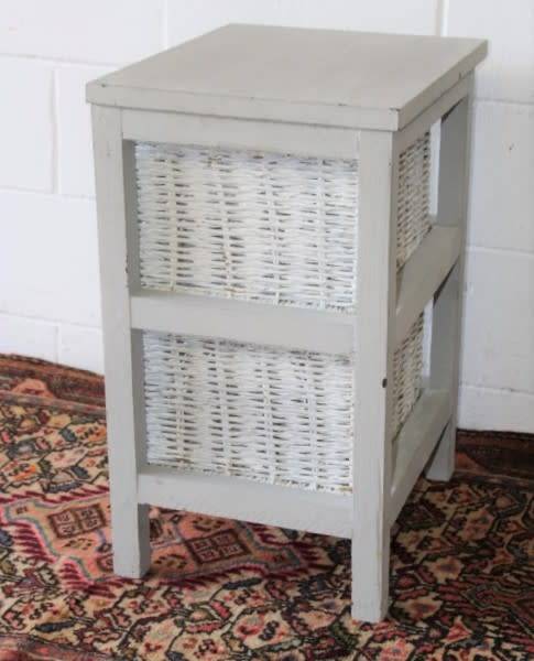 An awesome grey wooden 2-drawer pedestal with white wicker drawers - great in the bathroom