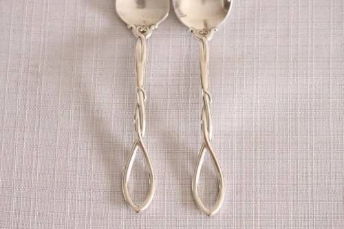 A beautiful antique sterling silver Art Nouveau (c1895 to 1910) USA made fruit spoon & fork set
