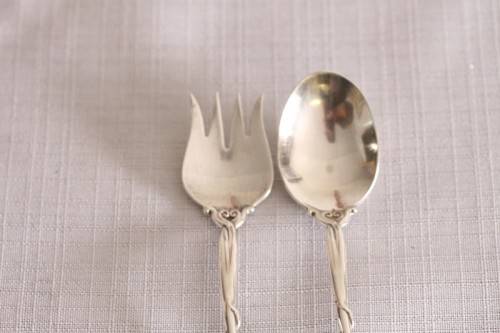 A beautiful antique sterling silver Art Nouveau (c1895 to 1910) USA made fruit spoon & fork set