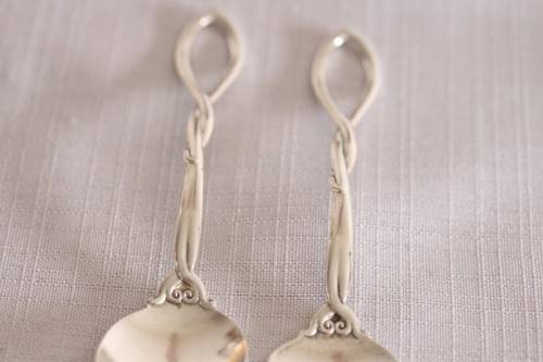 A beautiful antique sterling silver Art Nouveau (c1895 to 1910) USA made fruit spoon & fork set