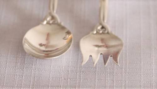 A beautiful antique sterling silver Art Nouveau (c1895 to 1910) USA made fruit spoon & fork set