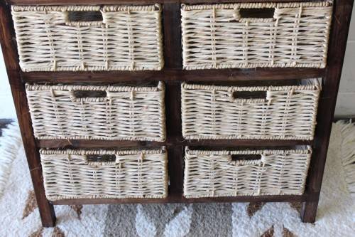 An awesome dark wooden 6-drawer cabinet with wicker drawers - great in the bathroom or bedroom!