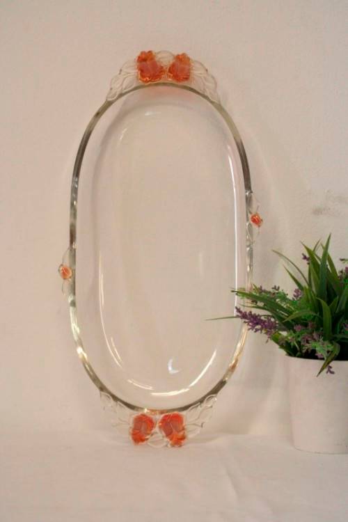 A stunning decorative oval shaped glass serving platter in excellent condition.