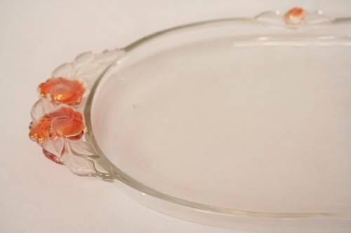 A stunning decorative oval shaped glass serving platter in excellent condition.