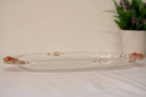 A stunning decorative oval shaped glass serving platter in excellent condition.
