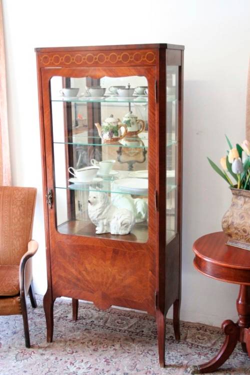 A superb vintage French Louis XV-style show case with beautiful marquetry inlay detailing